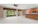 Living Room features carpet, large windows and access to the kitchen at 8539 Via Bella Notte, Orlando, FL 32836