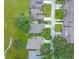 Aerial view of multiple homes in a neighborhood featuring mature trees and landscaping at 9 Abbey Ct, Haines City, FL 33844
