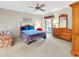 Charming bedroom with a cozy bed, wooden furniture, and a bright window for natural light at 9 Abbey Ct, Haines City, FL 33844