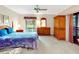 Comfortable bedroom featuring a bed, wooden furniture, and a view of the outdoors at 9 Abbey Ct, Haines City, FL 33844