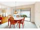 Bright dining room features an oval table, seating for four, and natural light at 9 Abbey Ct, Haines City, FL 33844