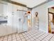 Well-lit kitchen featuring white appliances, ample cabinetry, and tiled floor at 9 Abbey Ct, Haines City, FL 33844