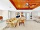 Bright living room features comfortable seating, ceiling fan, and unique wood ceiling at 9 Abbey Ct, Haines City, FL 33844