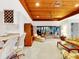 Bright living room with a wet bar, wood ceiling, and comfortable seating area, perfect for entertaining at 9 Abbey Ct, Haines City, FL 33844