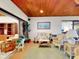 Relaxing sun room features wicker furniture, a painting, and natural light at 9 Abbey Ct, Haines City, FL 33844