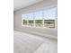 Bright and airy bedroom with large windows offering scenic outdoor views at 9155 Sheen Sound St, Orlando, FL 32836