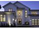 Beautiful two-story home with black-trimmed windows, modern lighting and inviting front entrance at 9155 Sheen Sound St, Orlando, FL 32836