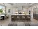 Open kitchen with a center island, barstool seating, and a view of the dining area at 9155 Sheen Sound St, Orlando, FL 32836