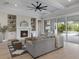 Inviting living room with a fireplace, sliding glass doors, and view of the outdoor grill at 9155 Sheen Sound St, Orlando, FL 32836