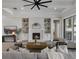 Inviting living room with a fireplace, built-in shelving, and cozy seating at 9155 Sheen Sound St, Orlando, FL 32836