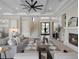 Open concept living area with a fireplace, staircase, and modern finishes throughout at 9155 Sheen Sound St, Orlando, FL 32836