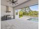 Well-equipped outdoor kitchen and living area featuring stainless steel appliances, grill, and a swimming pool at 9155 Sheen Sound St, Orlando, FL 32836