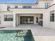 Stunning backyard featuring a modern pool, outdoor living area, and seamless transition to indoor spaces at 9155 Sheen Sound St, Orlando, FL 32836