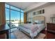 Bedroom with floor to ceiling windows and light blue accents at 101 S Eola Dr # 621, Orlando, FL 32801
