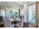 Dining area with balcony access and open concept to living areas at 101 S Eola Dr # 621, Orlando, FL 32801