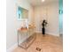 Inviting foyer with tile flooring, decorative mirror, console table, and stylish accents at 101 S Eola Dr # 621, Orlando, FL 32801