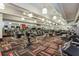 Spacious gym area with various exercise machines and mirrored walls for a complete fitness experience at 101 S Eola Dr # 621, Orlando, FL 32801