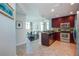 Open kitchen featuring stainless steel appliances, granite countertops, and bar seating at 101 S Eola Dr # 621, Orlando, FL 32801