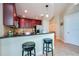 Contemporary kitchen with stainless appliances, granite counters, and raised breakfast bar at 101 S Eola Dr # 621, Orlando, FL 32801