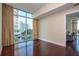 Bright living room featuring hardwood floors and expansive windows with beautiful city views at 101 S Eola Dr # 621, Orlando, FL 32801