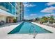 Refreshing pool area with lounge chairs, lush greenery, and a relaxing ambiance at 101 S Eola Dr # 621, Orlando, FL 32801