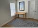 A space to work or relax, featuring natural light and a modern rug at 1040 N Clayton St, Mount Dora, FL 32757