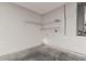 Unfinished basement with concrete floor, block walls, wire racks, and utility hookups at 1175 Seasons Blvd, Kissimmee, FL 34746