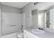 Clean bathroom featuring a tub, shower, and white vanity at 1175 Seasons Blvd, Kissimmee, FL 34746
