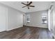 Spacious bedroom featuring wood floors, neutral paint, and ample natural light at 1175 Seasons Blvd, Kissimmee, FL 34746