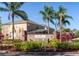 Attractive neighborhood entrance featuring lush landscaping and a brick sign with the Seasons logo at 1175 Seasons Blvd, Kissimmee, FL 34746