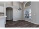 Bright dining room with dark wood floors and pendant lighting at 1175 Seasons Blvd, Kissimmee, FL 34746