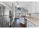 Bright kitchen featuring stainless steel appliances, and a dining area at 1175 Seasons Blvd, Kissimmee, FL 34746