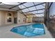 Inviting screened-in pool with ample patio space and attractive outdoor living at 1175 Seasons Blvd, Kissimmee, FL 34746