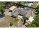 Aerial view of the home featuring a detached garage and swimming pool at 131 Lake Charles Rd, Deland, FL 32724