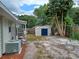 Backyard view featuring storage shed and equipment at 131 Lake Charles Rd, Deland, FL 32724