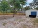 Large backyard includes a storage shed and mature trees at 131 Lake Charles Rd, Deland, FL 32724