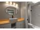 Modern bathroom with a stylish vanity, mirror, and a walk-in shower at 131 Lake Charles Rd, Deland, FL 32724