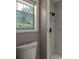 Updated bathroom featuring a toilet and a window to the outside at 131 Lake Charles Rd, Deland, FL 32724