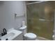 Bathroom features an enclosed glass shower and modern vanity at 131 Lake Charles Rd, Deland, FL 32724