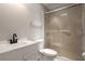 Bathroom featuring a white vanity, toilet, and glass-enclosed shower at 131 Lake Charles Rd, Deland, FL 32724