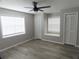 Comfortable bedroom featuring a ceiling fan, and ample natural light at 131 Lake Charles Rd, Deland, FL 32724