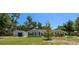 Charming single-story home with a spacious yard, mature trees, and a detached garage at 131 Lake Charles Rd, Deland, FL 32724