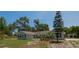 Attractive one-story home with mature landscaping, quaint shutters, and a well-manicured lawn at 131 Lake Charles Rd, Deland, FL 32724