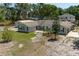 Aerial view of home and landscape including detached garage at 131 Lake Charles Rd, Deland, FL 32724