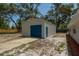 Spacious detached garage/workshop with blue door and adjacent driveway at 131 Lake Charles Rd, Deland, FL 32724