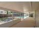Spacious screened lanai offers a view of the pool and backyard at 131 Lake Charles Rd, Deland, FL 32724
