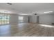 Bright and airy living area with large windows, modern light fixture and neutral decor at 131 Lake Charles Rd, Deland, FL 32724