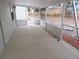 Large screened-in patio with wood-look floors at 131 Lake Charles Rd, Deland, FL 32724