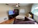 Bedroom featuring a television, wardrobe, and comfortable seating area at 1329 Se 36Th Ave, Ocala, FL 34471
