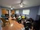 Spacious bedroom with wood floors, ceiling fans, and natural light from windows at 1329 Se 36Th Ave, Ocala, FL 34471